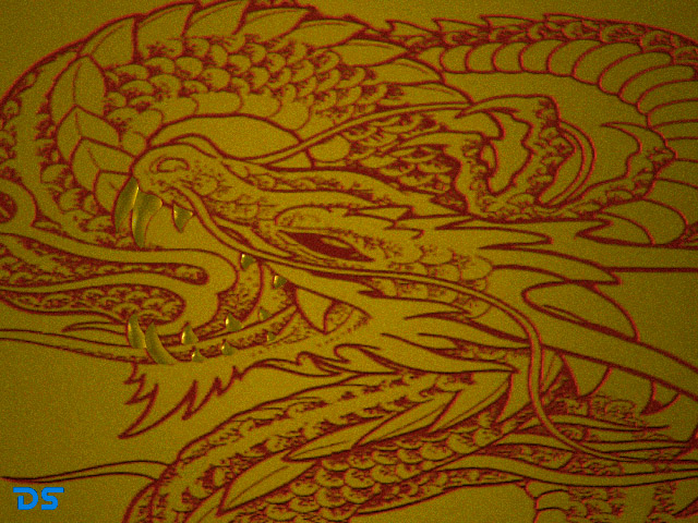 red dragon with golden teeth